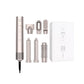 Silver 6-in-1 Ultra Styler hair styling tool with all accessories displayed: concentrator nozzle, diffuser, round brush, flat iron, curling barrel, and box. Compact design for versatile styling at home or on travel.