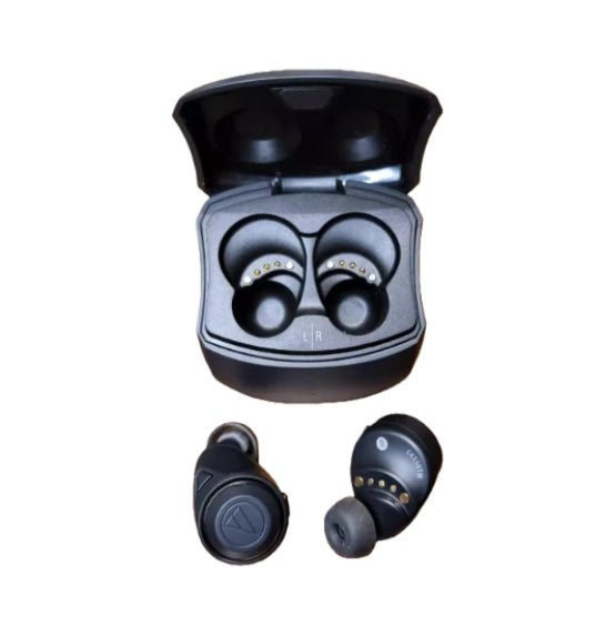 Black Audio-Technica ATH-CKS50TW2 wireless earbuds inside open charging case, showing compact design and built-in battery contacts
