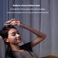 A woman using the Breo Scalp Mini on her head before bed. The device gently massages the scalp to relieve tension, reduce stress, and promote better sleep quality.