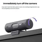 Side view of the graphite Brio 500 webcam, showing the rotating lens cap that instantly covers the camera for privacy when not in use.