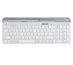 Clean overhead view of the off-white Logitech K580 wireless keyboard, highlighting its ultra-thin profile, integrated device slot, and quiet low-profile keys.