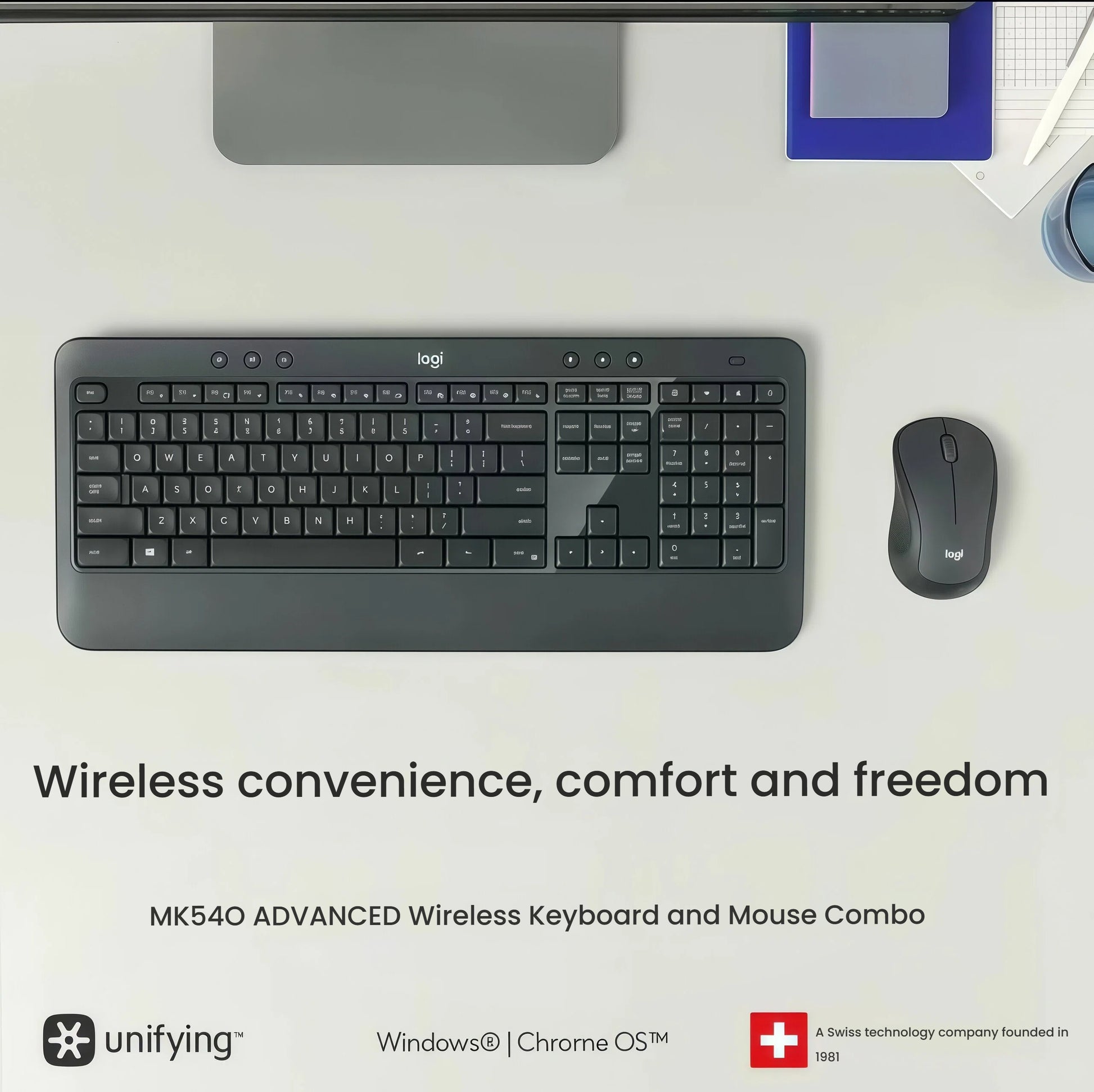 Clean, modern desk scene with the MK540 keyboard and mouse beside a monitor, notebook, and coffee mug, emphasizing clutter-free wireless productivity.