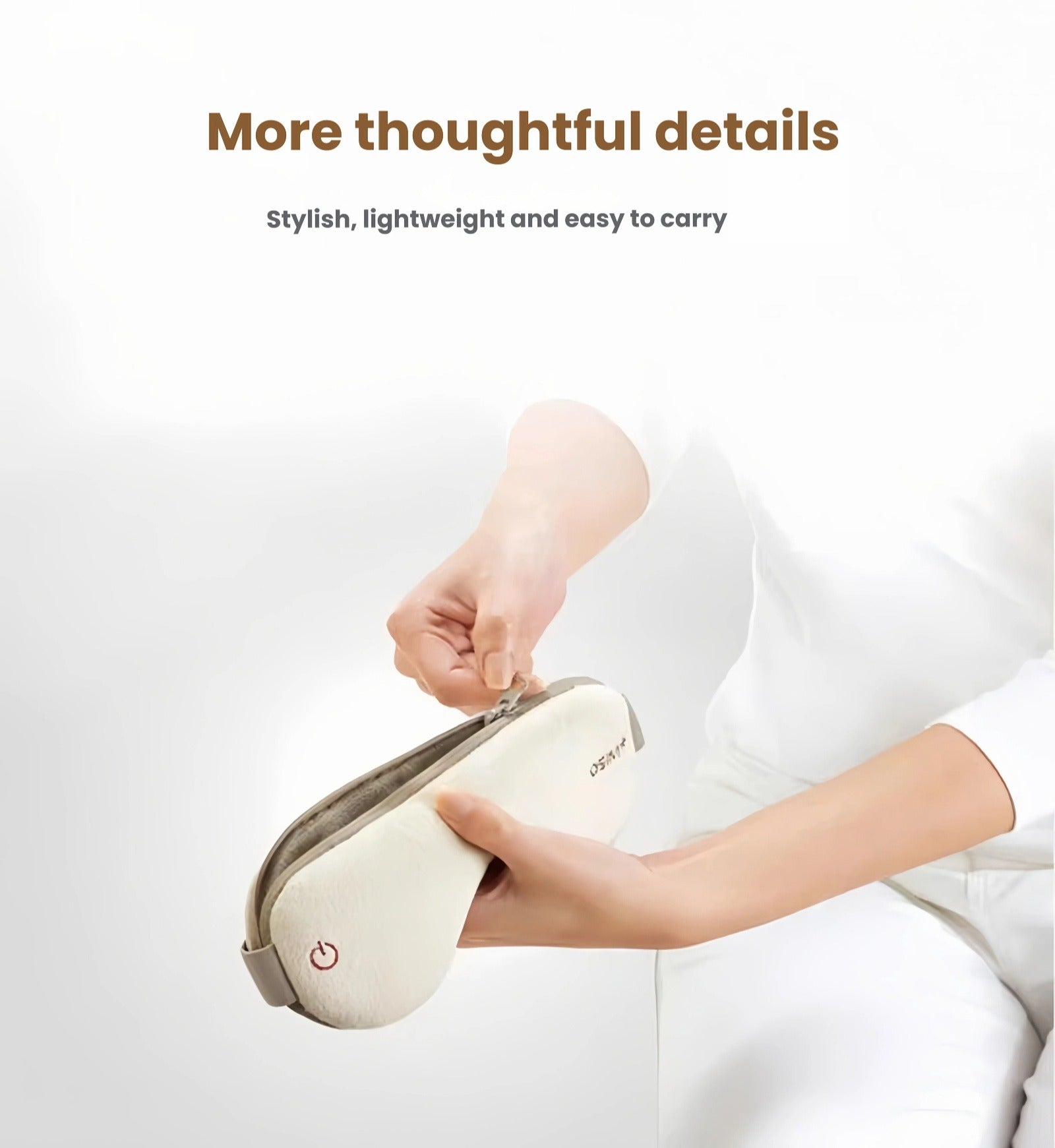 Two OSIM uMask eye massagers in white and navy blue displayed on a cozy bed with soft linens. The premium design combines comfort, style, and advanced eye care technology for daily use at home or travel.