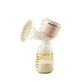October Crystal portable electric breast pump in soft pink color; all-in-one design with floral-patterned flange, transparent milk bottle containing expressed milk, ideal for discreet and comfortable pumping
