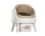 PetPivot self-cleaning litter box in beige and white — front view showing clean lines, ergonomic shape, and integrated waste drawer