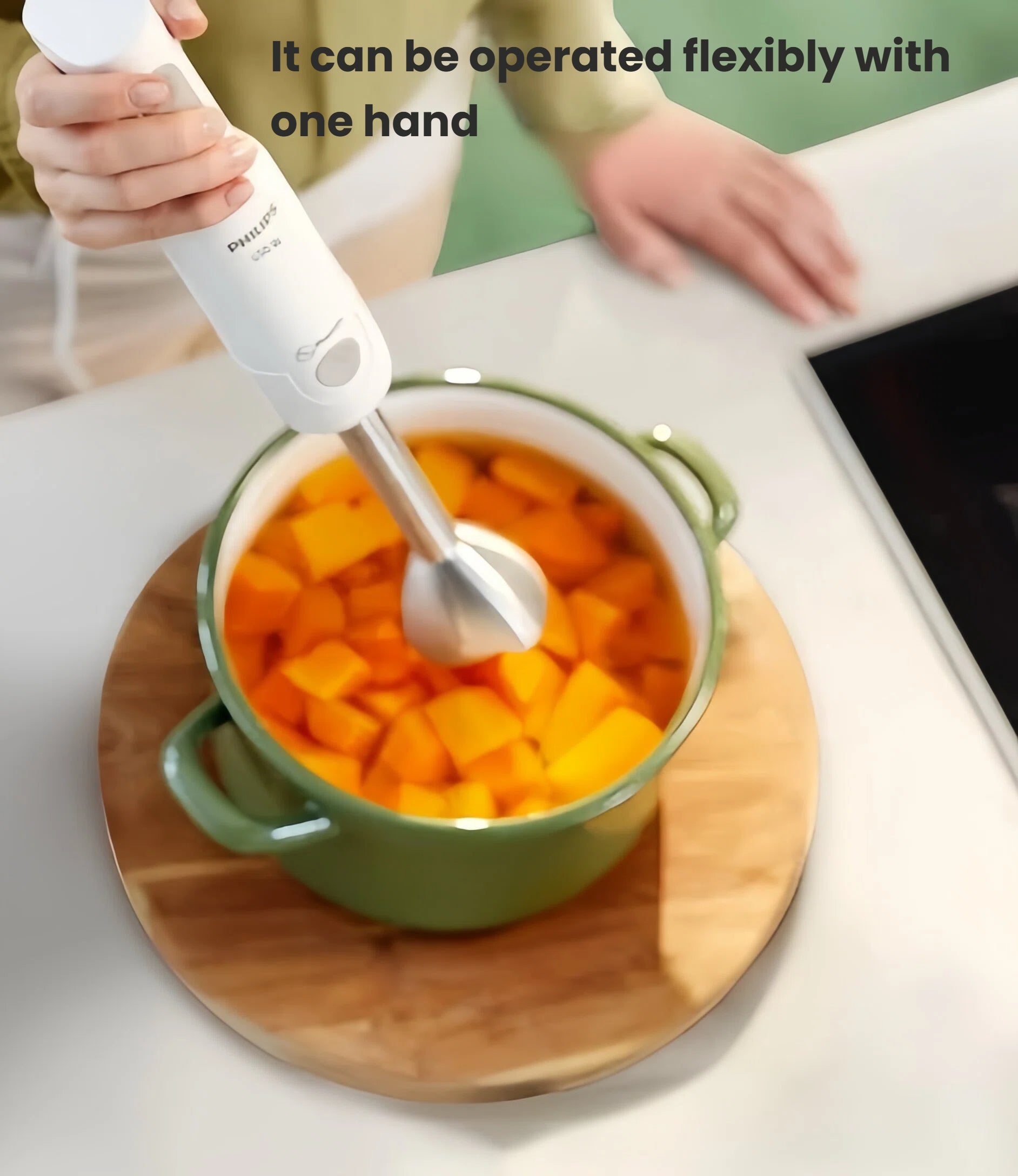 Philips Avent handheld blender used one-handed to blend cooked pumpkin cubes directly in pot—no need to transfer, reducing mess and saving time.