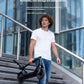 A man easily carrying the folded Segway F2 KickScooter down a flight of stairs, showcasing its convenient one-click folding mechanism for easy portability and storage.