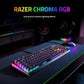 Gaming desk setup with the Razer BlackWidow V4 X mechanical keyboard glowing with dynamic Razer Chroma RGB lighting effects, paired with a matching mouse and headset, creating an immersive and colorful gaming environment.