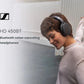 Woman wearing Sennheiser HD 450BT Bluetooth noise-canceling headphones outdoors, enjoying premium sound and comfort