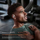 Man sweating during workout wearing Shokz OpenFit 2+ earbuds — IP55 rated protection ensures durability and performance even during vigorous exercise and heavy perspiration.