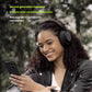 Woman smiling while using Shure AONIC 50 Gen2 wireless noise-canceling over-ear headphones outdoors, showcasing advanced active noise cancellation and premium design for on-the-go listening.