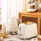 A beautiful lifestyle image showing the Smeg 4-Slice Toaster in cream as part of a matching breakfast set with the Smeg 50's Style Kettle, creating a coordinated retro kitchen aesthetic.