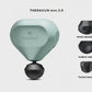 Sage green Theragun Mini 2.0 displayed with shock-absorbing, medium and thumb massage heads for targeted therapy.