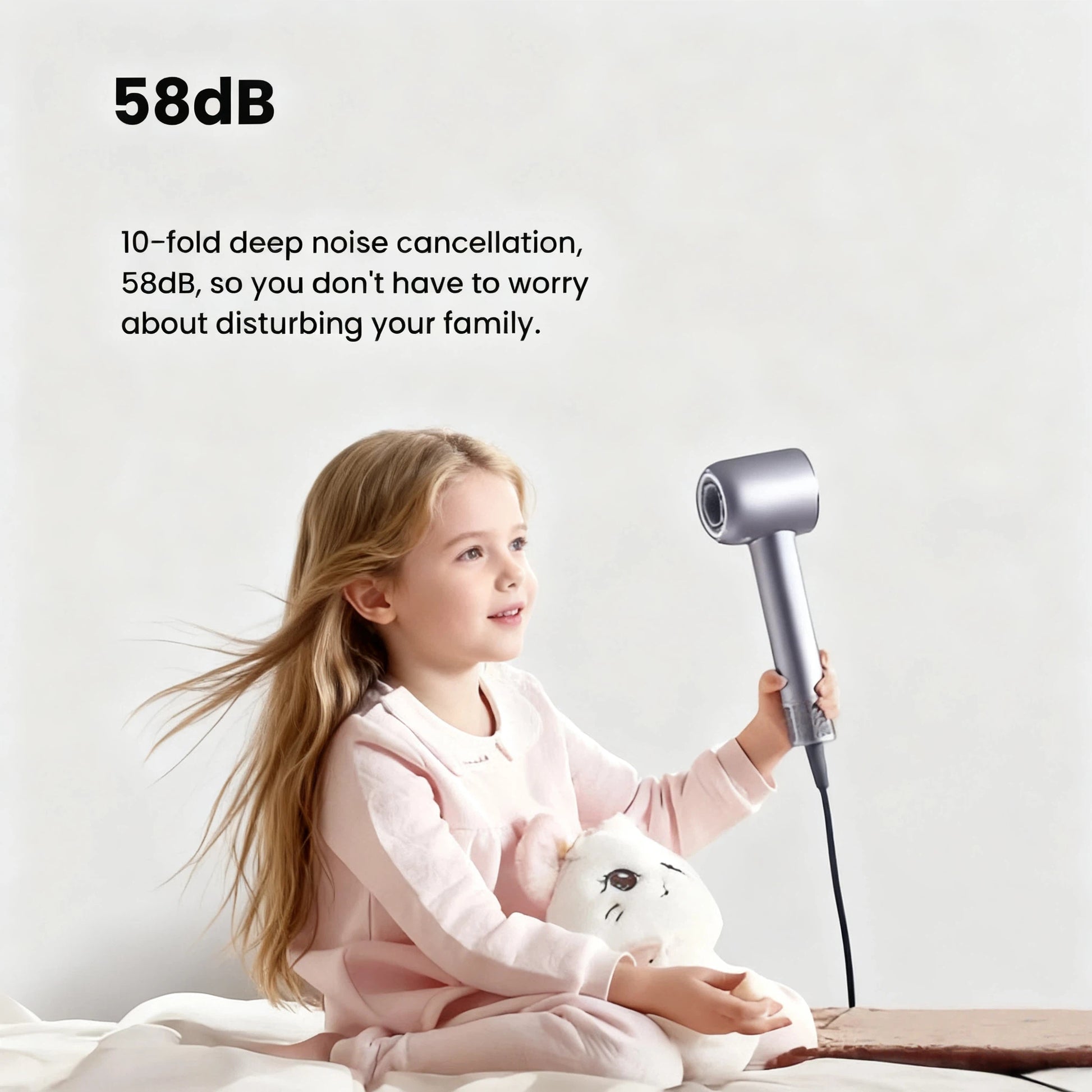 A child happily holding the Dreame Hair Glory to illustrate its quiet 58dB low-noise operation, which is suitable for use without disturbing the family.