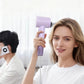 A woman comfortably using the purple Laifen SE hair dryer, highlighting its low-key and quiet operation at only 59dB.